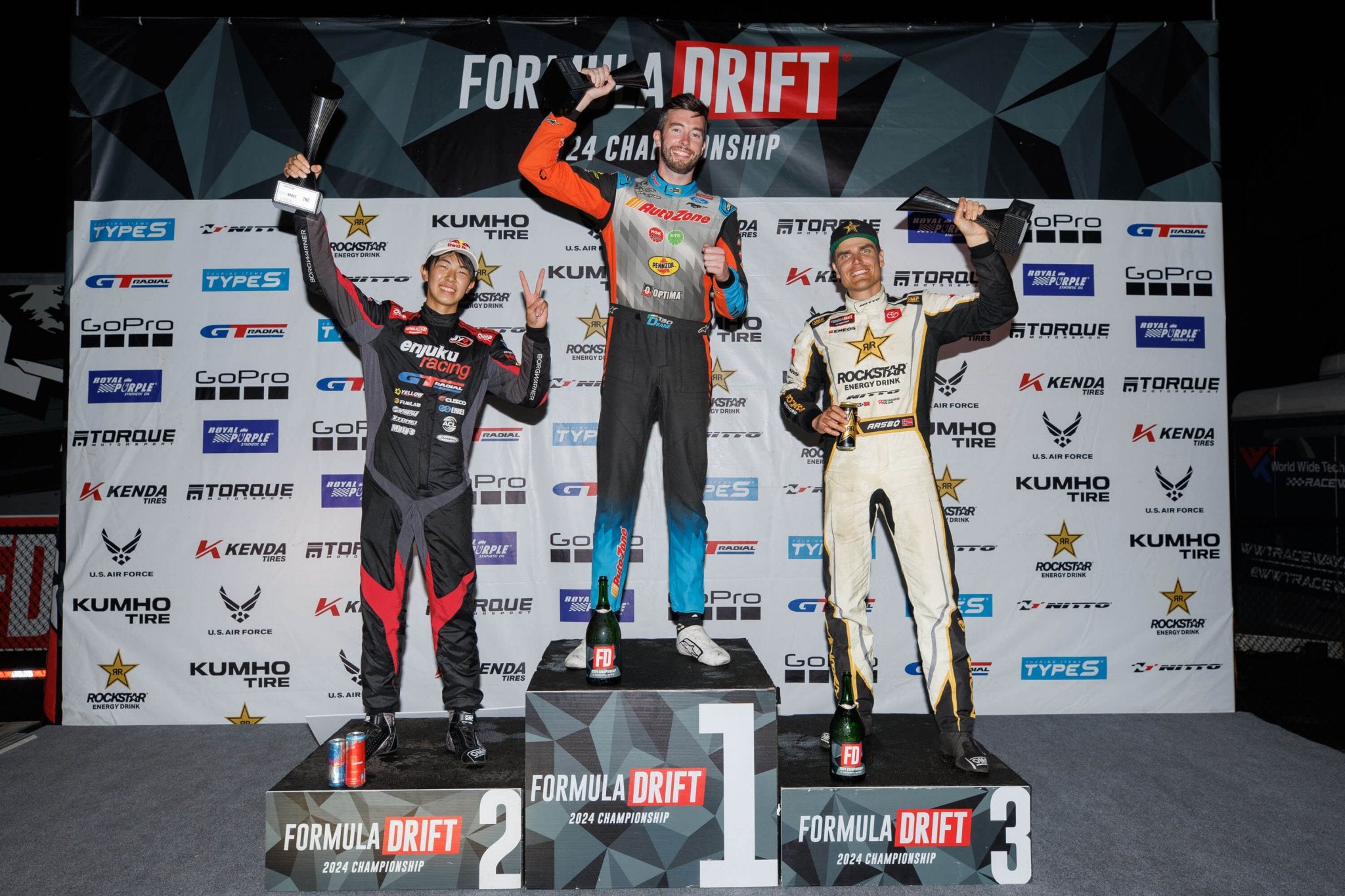 James Deane stands on top of the podium after winning Formula Drift St. Louis