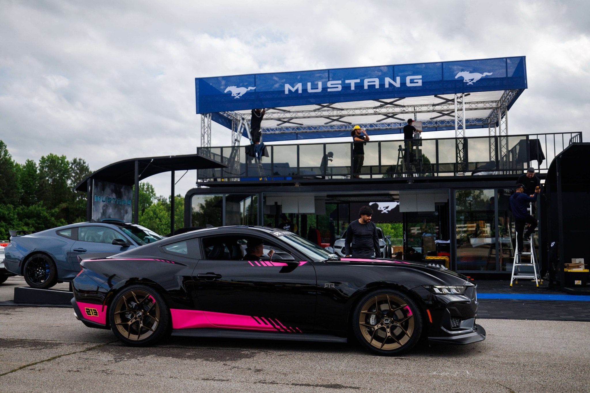 Ben Hobson Edition Mustang RTR Spec 2 in front of Mustang Unleashed display