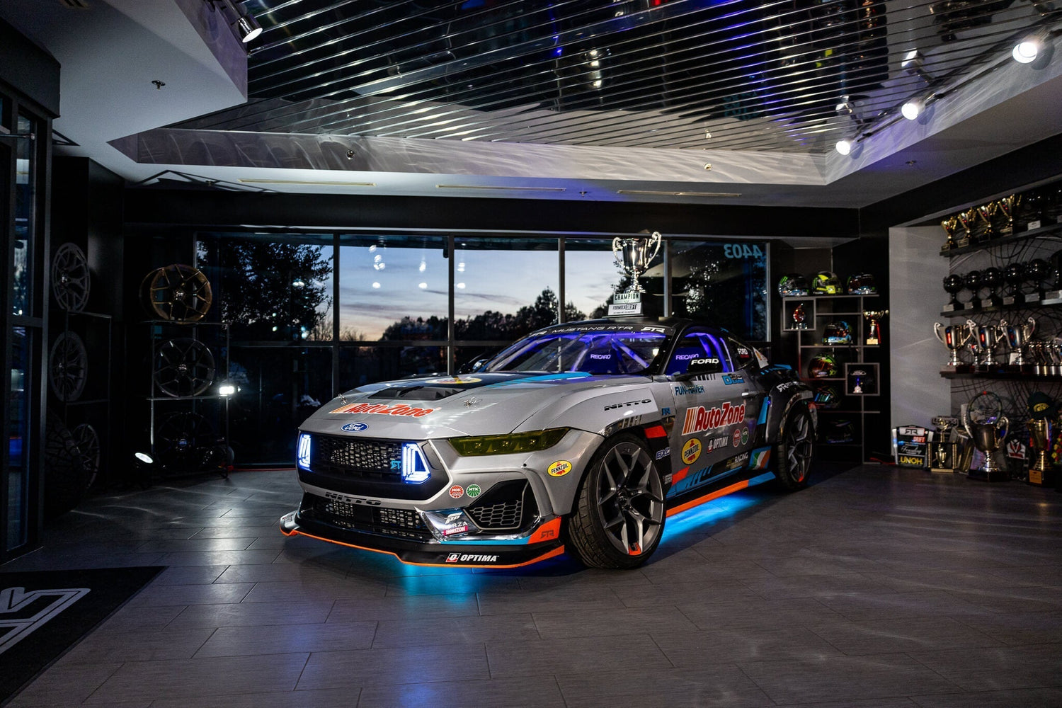 James Deane's Championship winning 2024 Mustang RTR Spec 5-FD displayed indoors with James' FD championship trophy