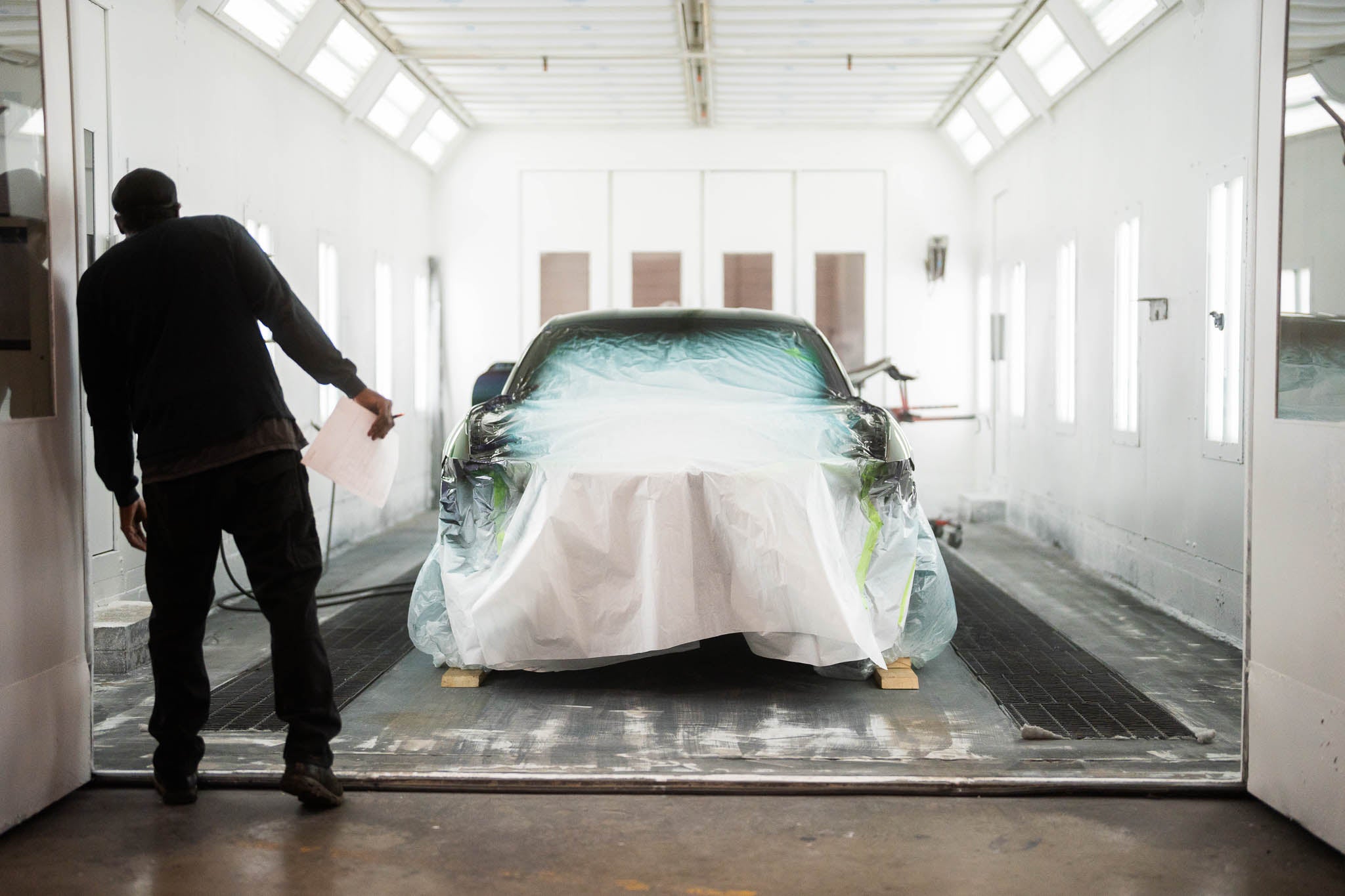 A mystichrome Mustang RTR mid-application in a paint booth