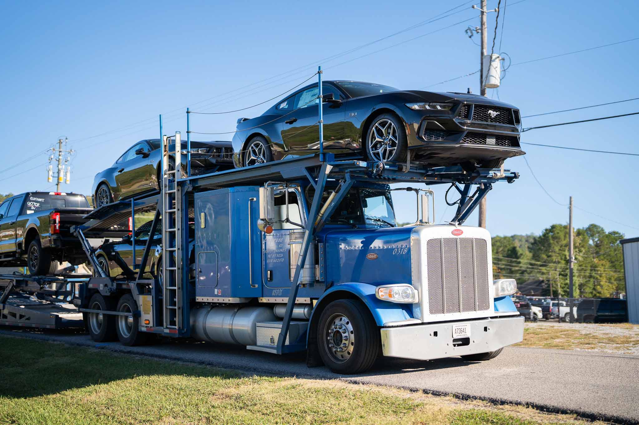 Mustangs arrive on a trailer to be turned into Mustang RTRs