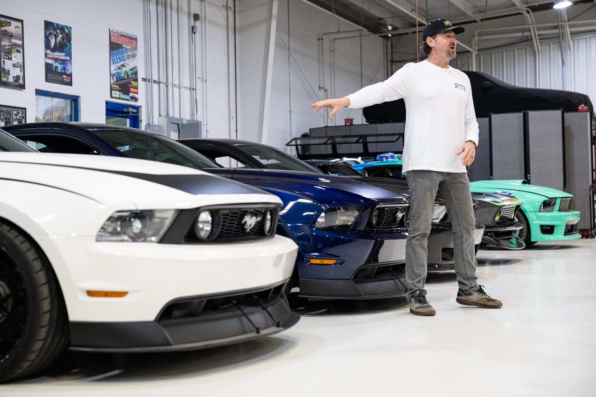 Vaughn Gittin Jr telling the story of RTR with the museum cars in the RTR Lab