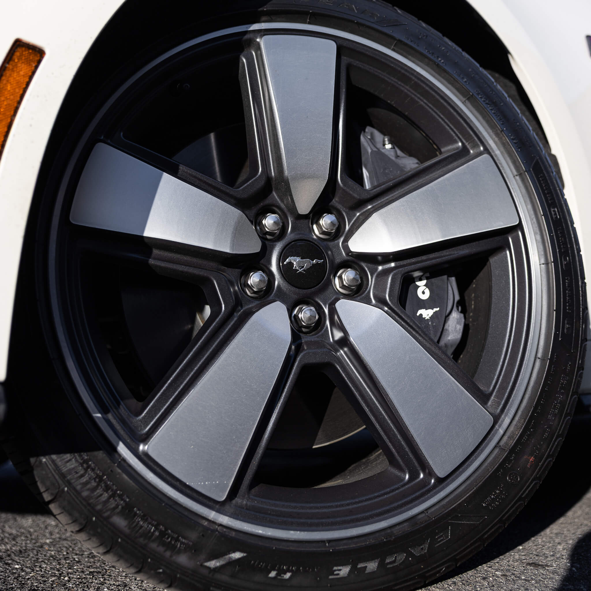 Close up photo on the wheel options on a 2025 60th anniversary mustang in Wimbledon White