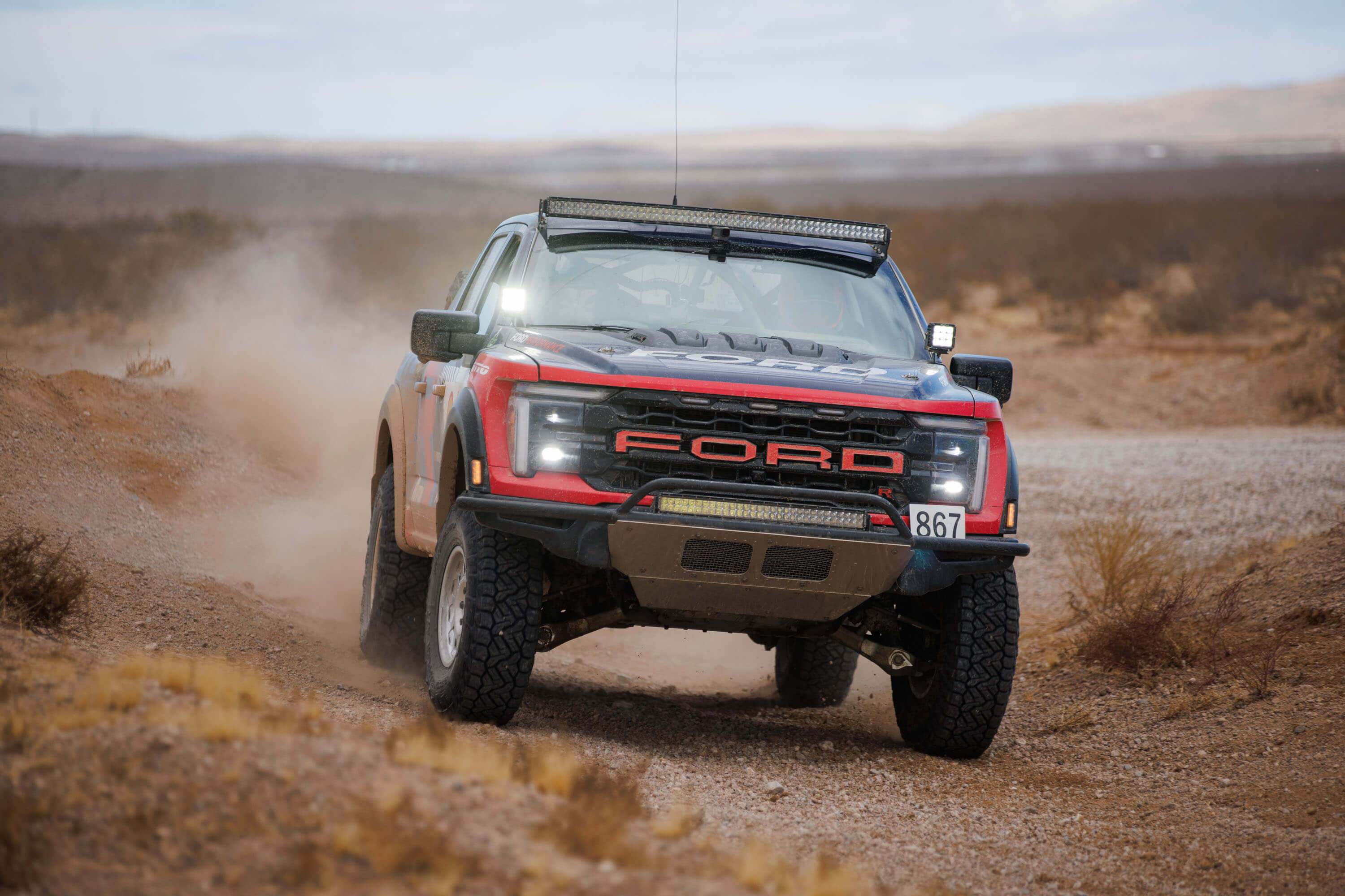 The RTR Vehicles Off-Road Team Ford F-150 Raptor R powers through the Mint 400 course, demonstrating its dominance in the Stock Full-Size Class.