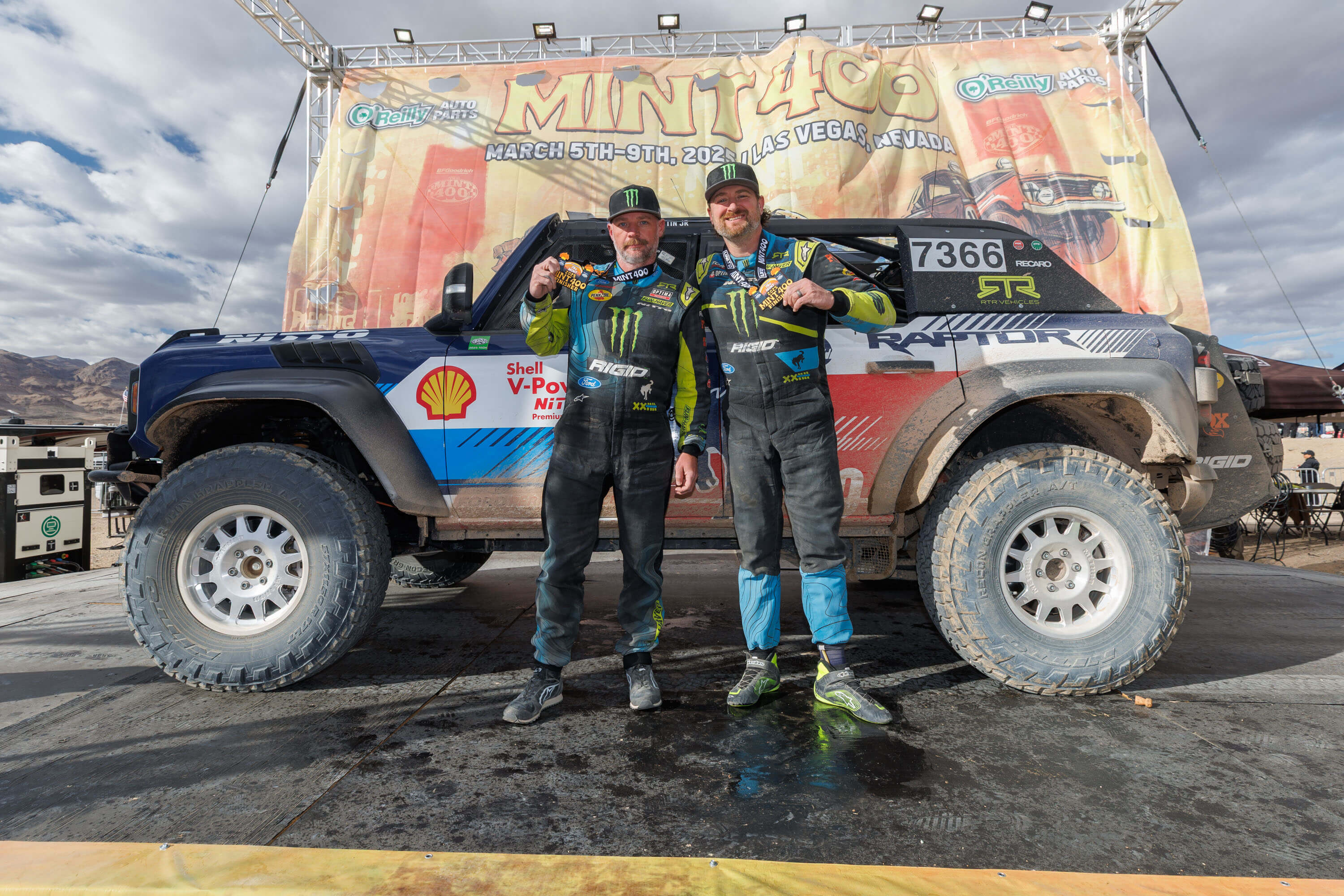 Vaughn Gittin Jr. celebrates on the podium with his RTR Vehicles Off-Road Team Ford Bronco Raptor after securing second place at the Mint 400