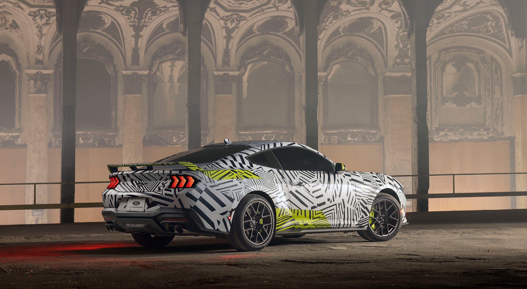 a rear view of the Mustang RTR in dazzle camo in a historic building