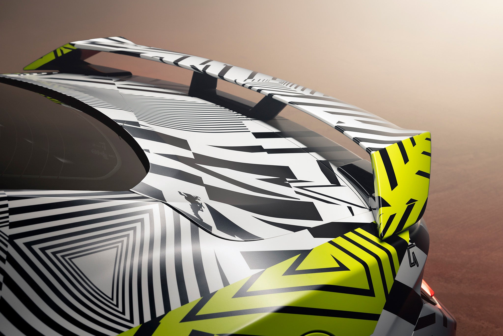 Detailed view of the Mustang RTR's rear wing in Dazzle camo with nods to the Iconic Ford Mustang logo