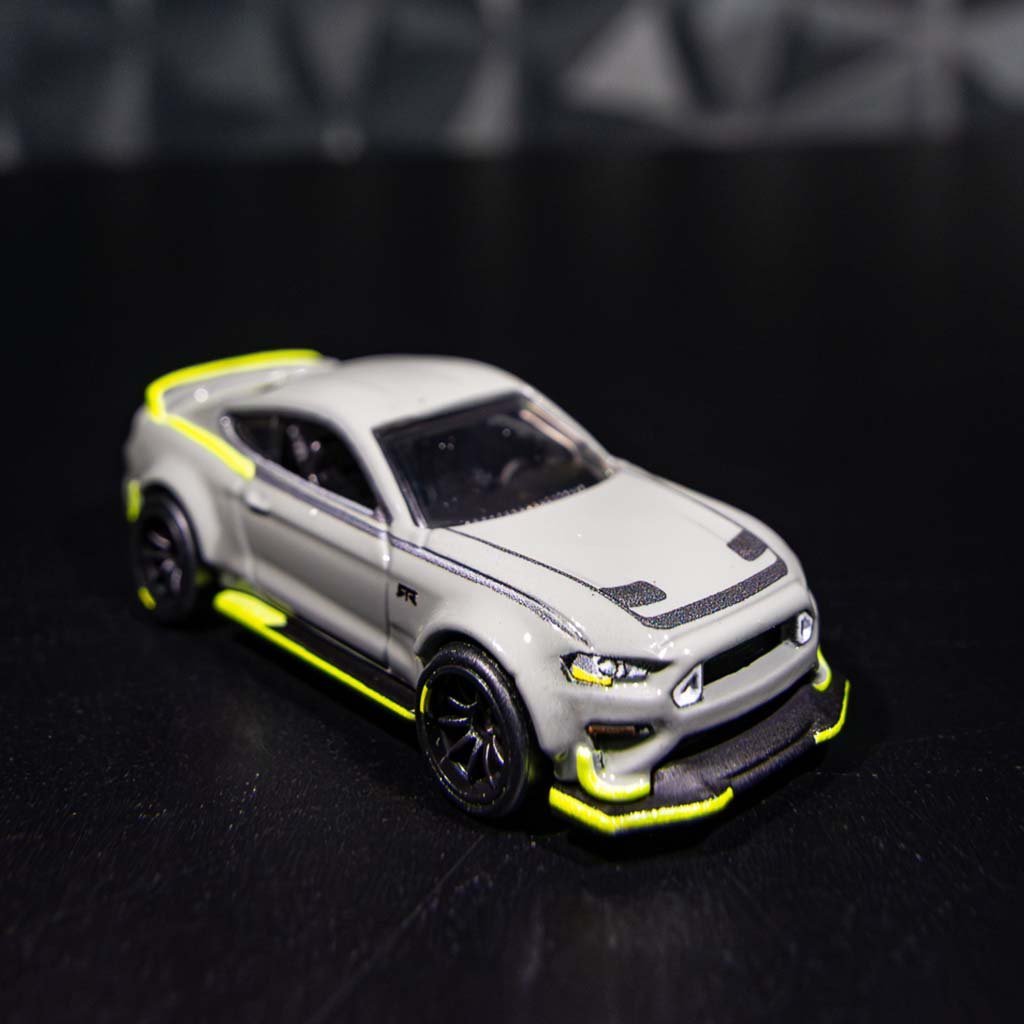 Close-up of the 10th Anniversary Mustang RTR Spec 5 Hot Wheels showcasing detailed features like Forged Wheels and Widebody Flares.