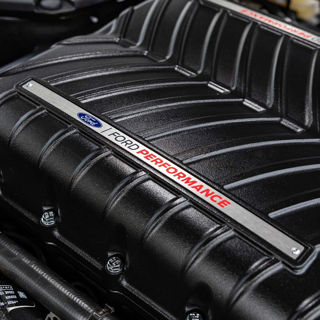 Close-up of the Ford Performance Supercharger Kit for 2024 Mustang GT and Dark Horse, highlighting the engine components and advanced supercharger features.