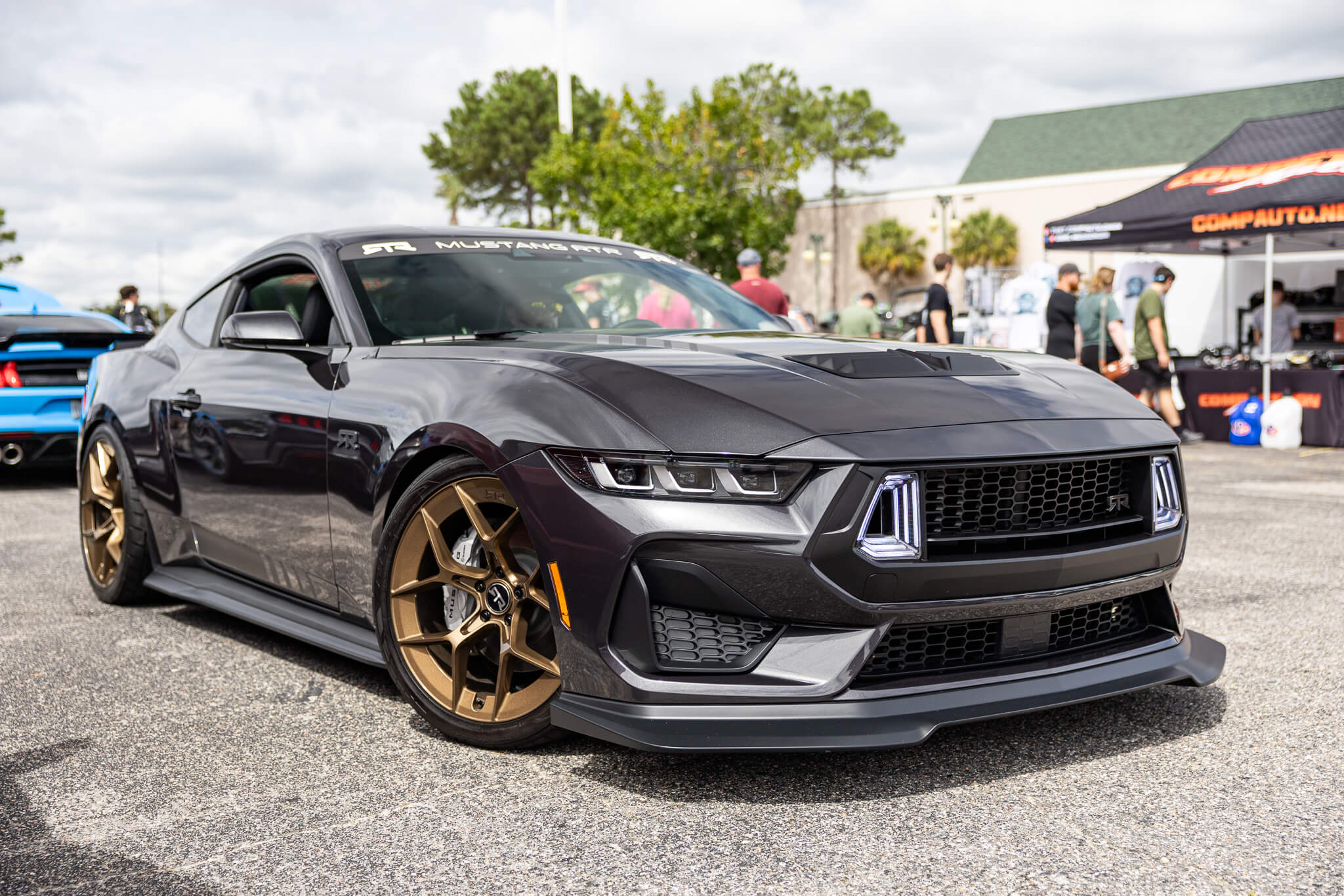 Black 2024 Mustang eqiuipped with RTR Lower Aero Package (24+ Mustang) featuring chin splitter, rocker splitters, and rear quarter splitters for enhanced aerodynamics and stability.