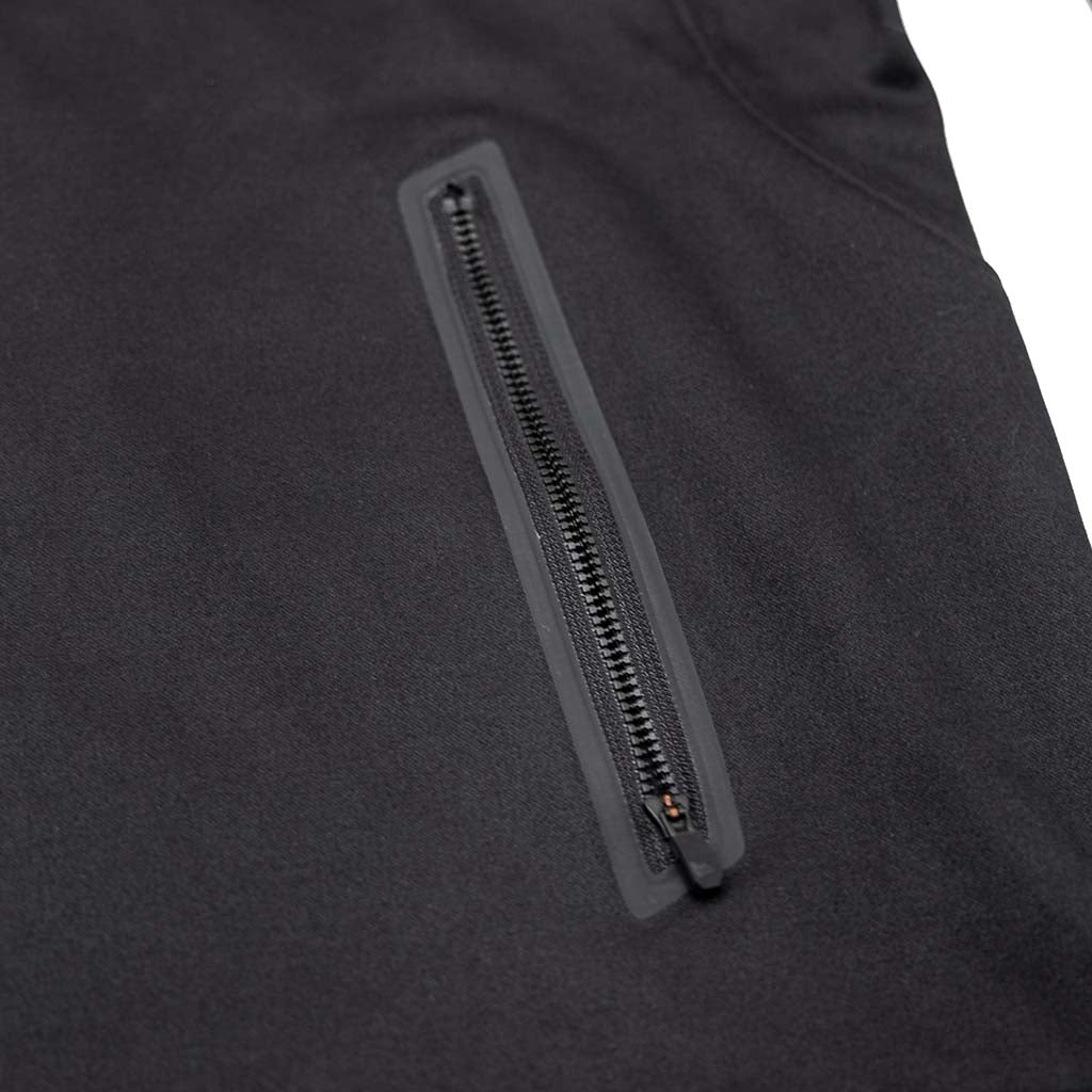 Close-up of the RTR Quarter Zip Pullover, highlighting the sleek exposed Vislon zipper on a black jacket, emphasizing its modern, sophisticated design.