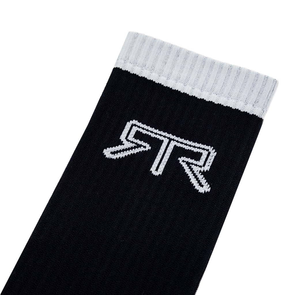 RTR Socks featuring a black and white design with grey text detail, showcasing Clutch Kick and Loud Pedal phrases on each sock.